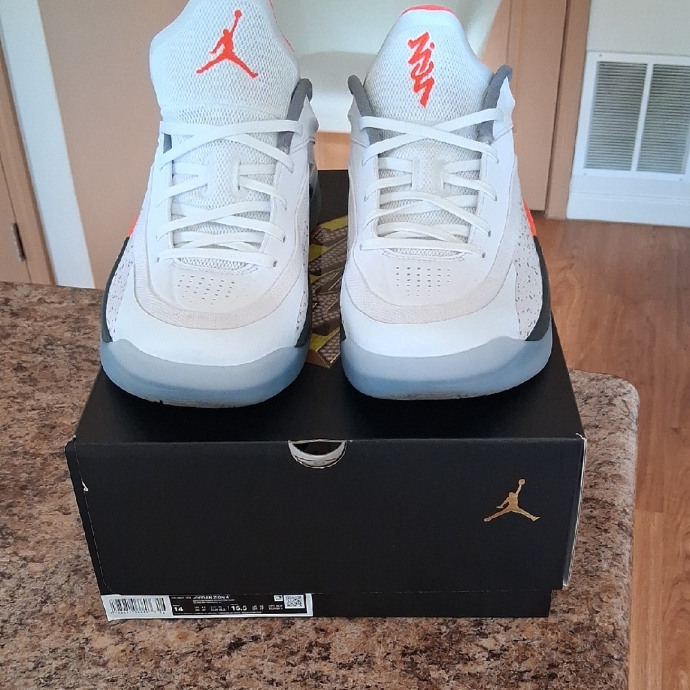 White and Gray Sneakers with Red Accents